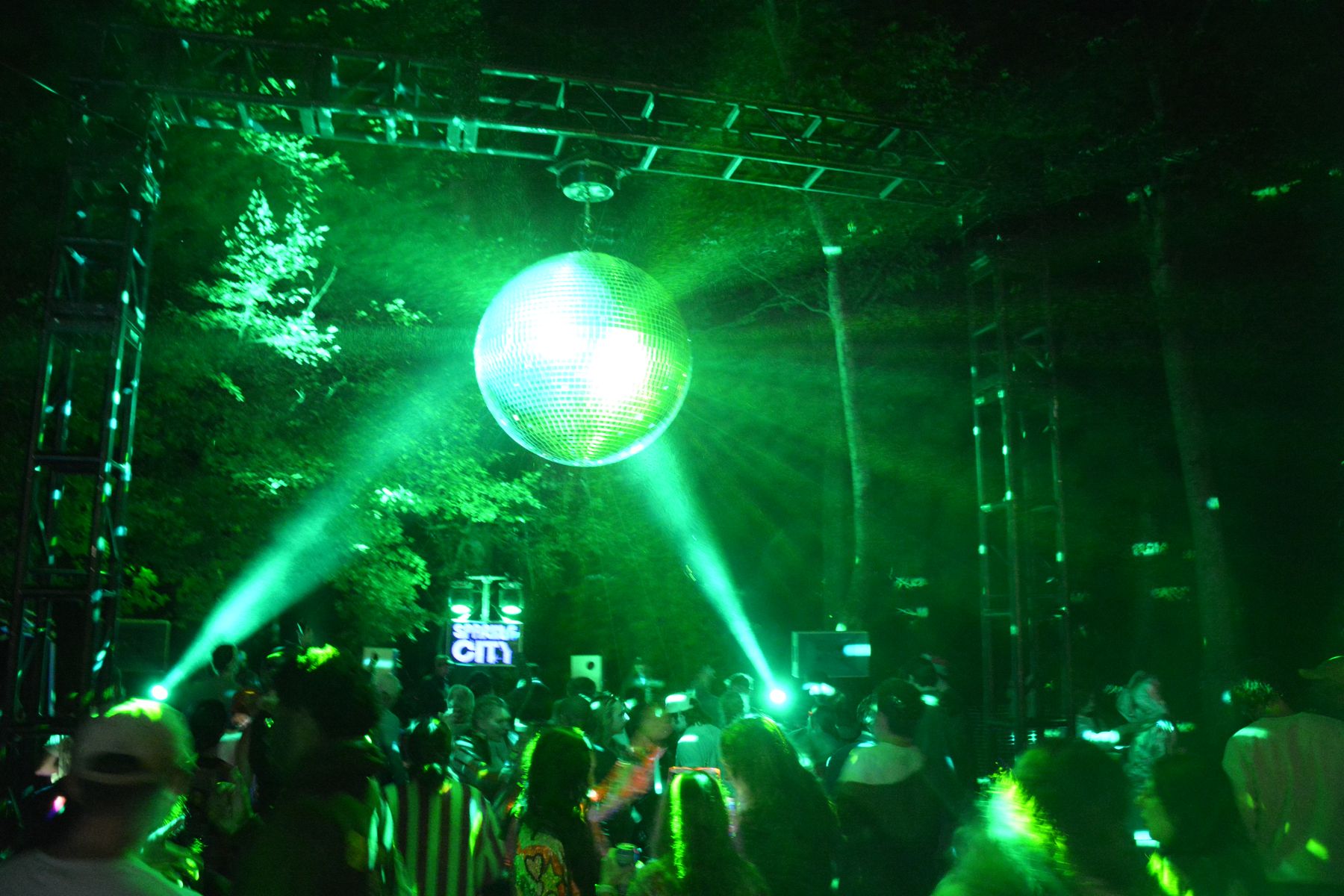 Green lasers and the disco ball over the dance floor