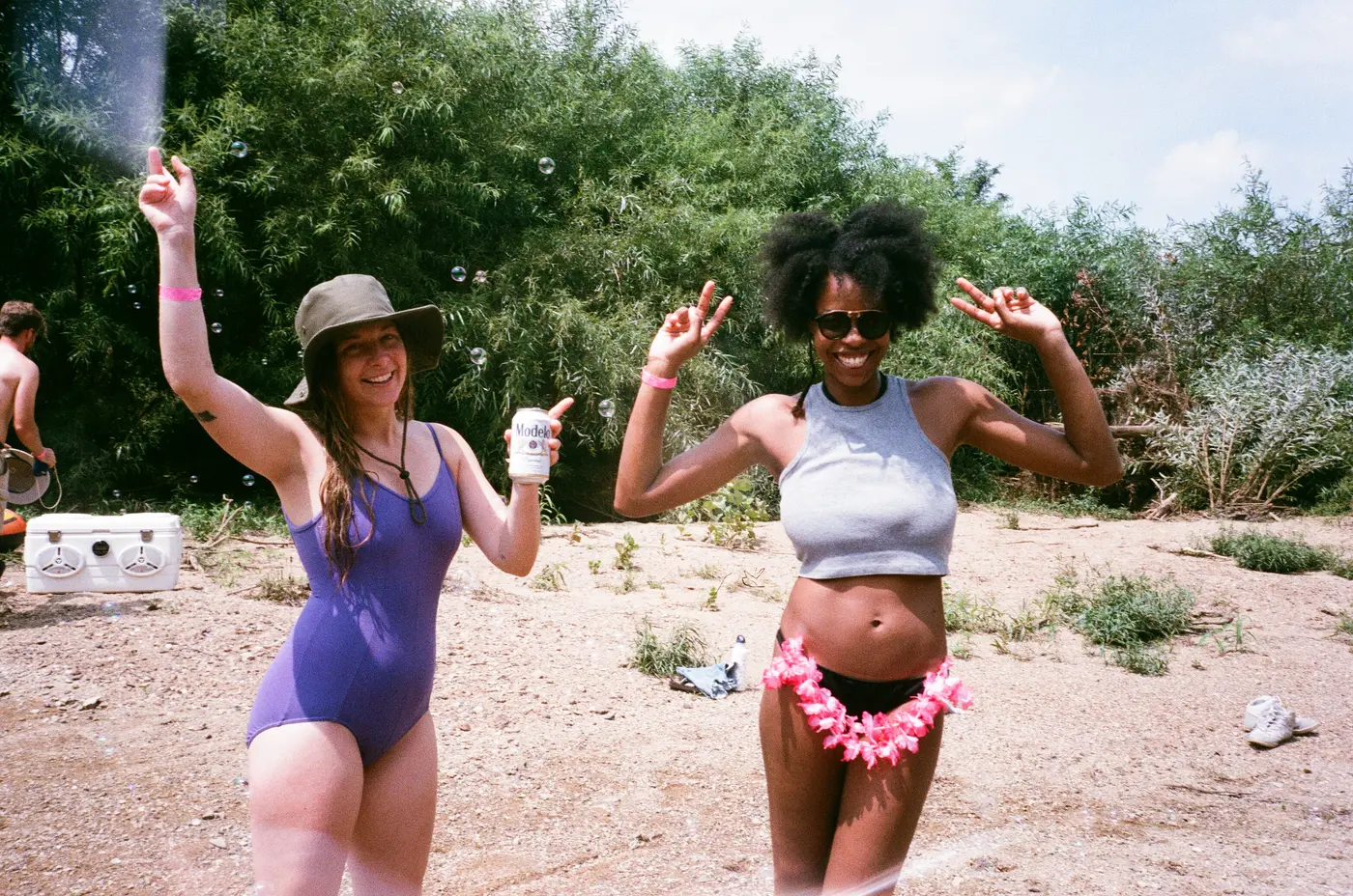 Peace signs and bubbles on the riverbank