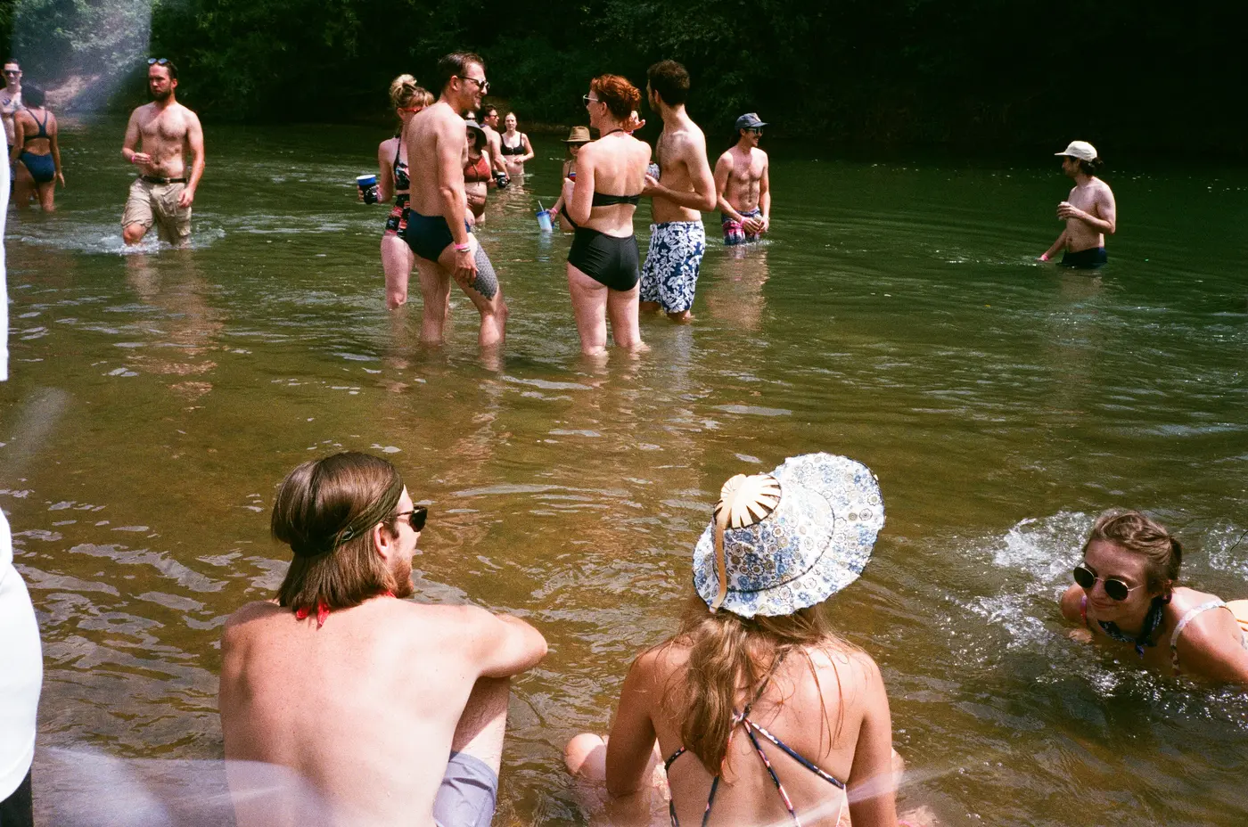 Friends cooling off waist-deep in the Buffalo