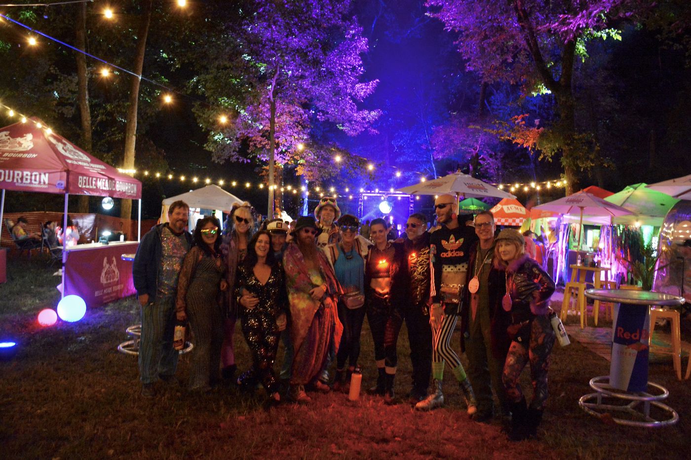 Friends under string lights at night